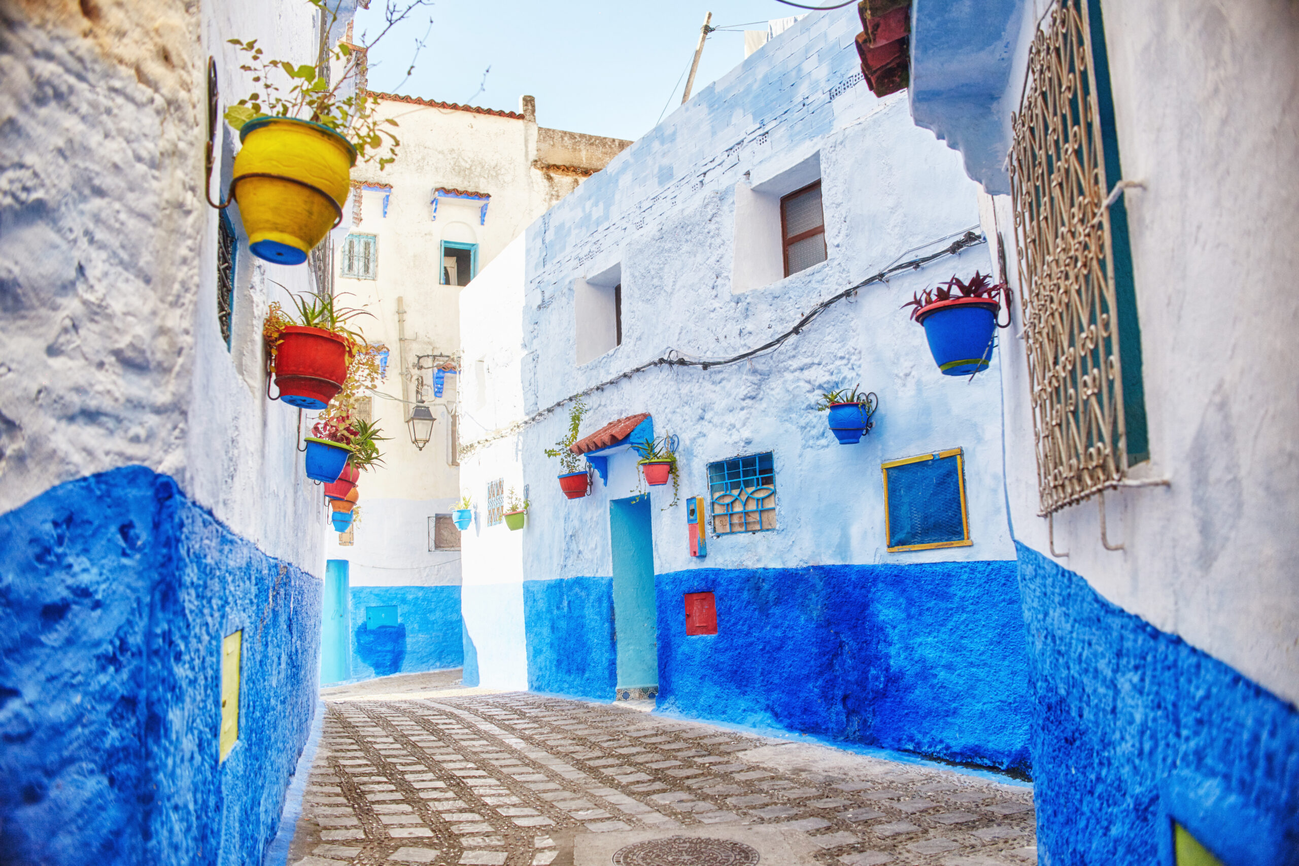 Morocco is the blue city of Chefchaouen, endless streets painted in blue color. Lots of flowers and Souvenirs in the beautiful streets of Chefchaouen. A magical fairy-tale city of heavenly color